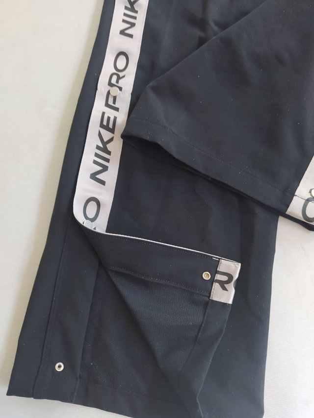Pantalon Nike corchetes mujer