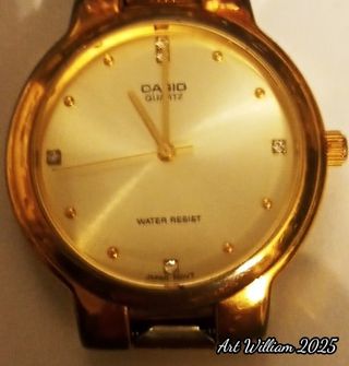 Reloj  CASIO 5 brillantes baño oro 24klt