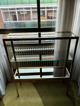 Mobili libreria in oro e vetro