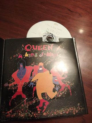 Cd y libro Queen