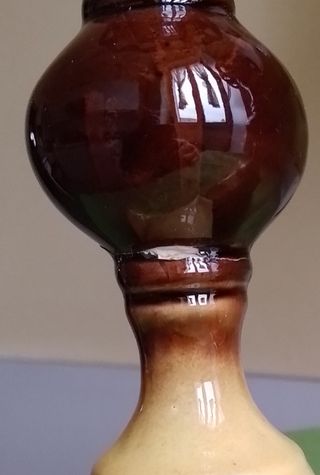 Coppia porta candele in ceramica.