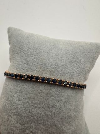 Pulsera riviere de oro rosa de 18 kt con zafiros