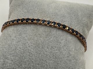 Pulsera riviere de oro rosa de 18 kt con zafiros