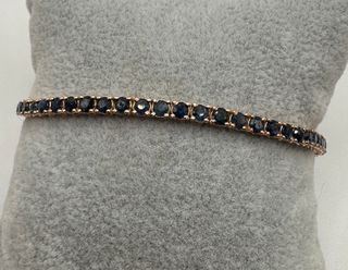 Pulsera riviere de oro rosa de 18 kt con zafiros