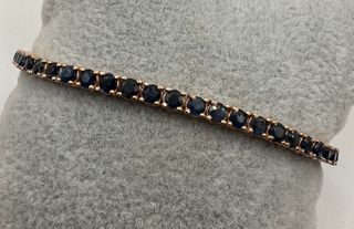 Pulsera riviere de oro rosa de 18 kt con zafiros