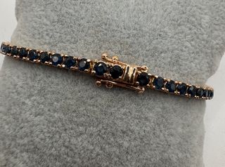 Pulsera riviere de oro rosa de 18 kt con zafiros