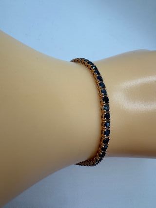 Pulsera riviere de oro rosa de 18 kt con zafiros