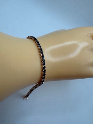Pulsera riviere de oro rosa de 18 kt con zafiros