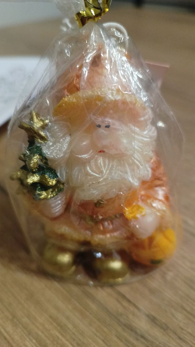 Candela natalizia a forma di Babbo Natale