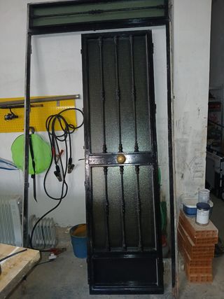 Puerta de dos hojas de forja, esta en perfectas