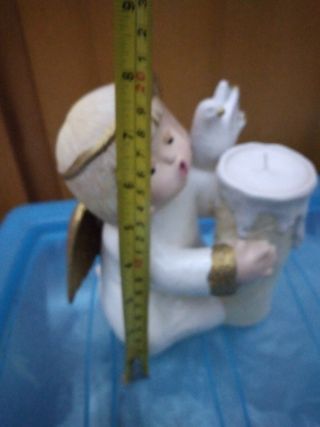 Angelo con candela Natale