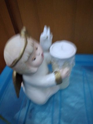 Angelo con candela Natale