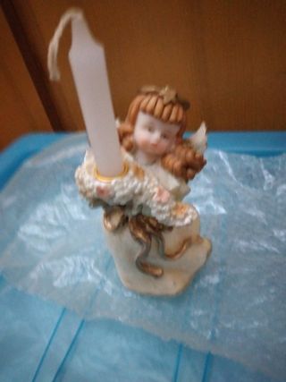 Angelo con candela Natale