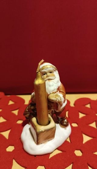 Babbo Natale di ceramica smaltata con candela