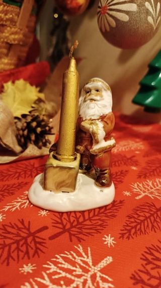 Babbo Natale di ceramica smaltata con candela