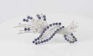 Broche vintage en oro 18k con zafiros y brillantes