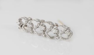 Broche antiguo en oro blanco y amarillo 18k