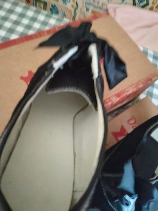 Zapatos manteo o traje regional