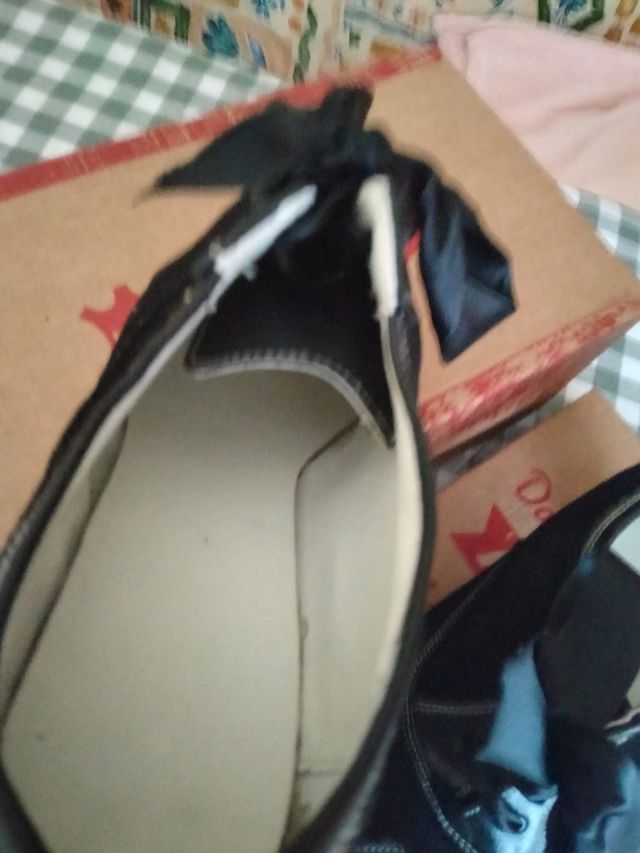 Zapatos manteo o traje regional