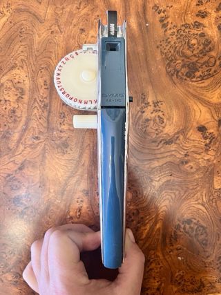 Dymo antigua con caja transporte