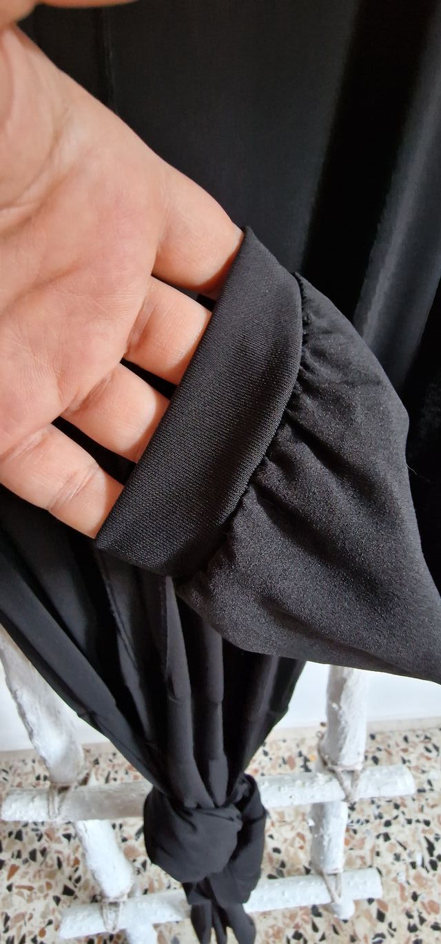 Tuta nera intera lucida da sera