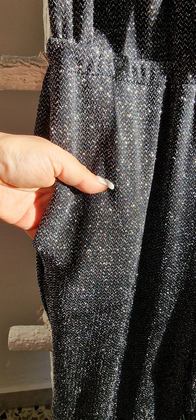 Tuta nera intera laminata da sera