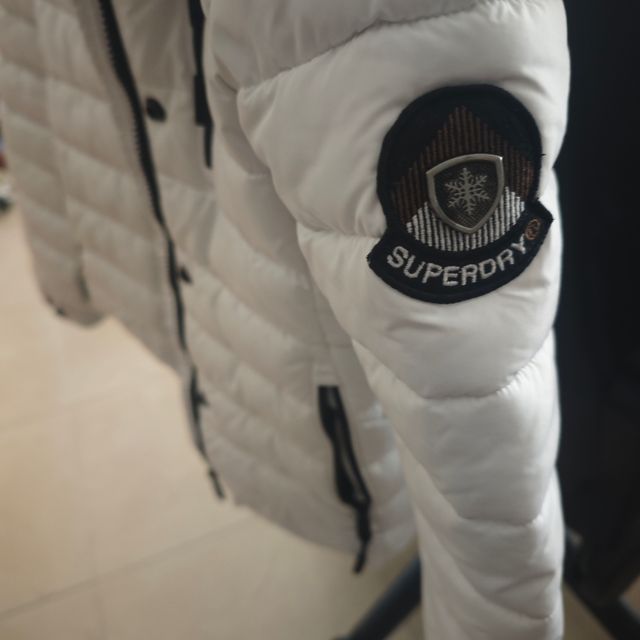 Abrigo ,plumas de niña