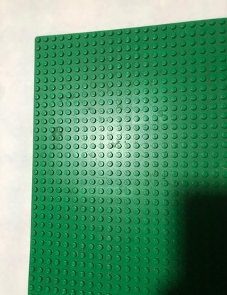 lego pezzi colore verde e base lego spazio '70