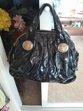 Bolso Gucci de mano negro charol