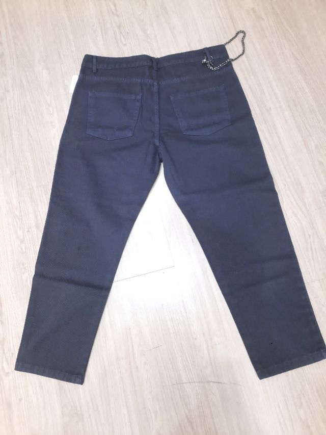 Jeans strappato blu uomo catena