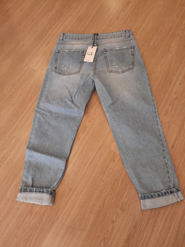 Jeans strappato chiaro largo uomo