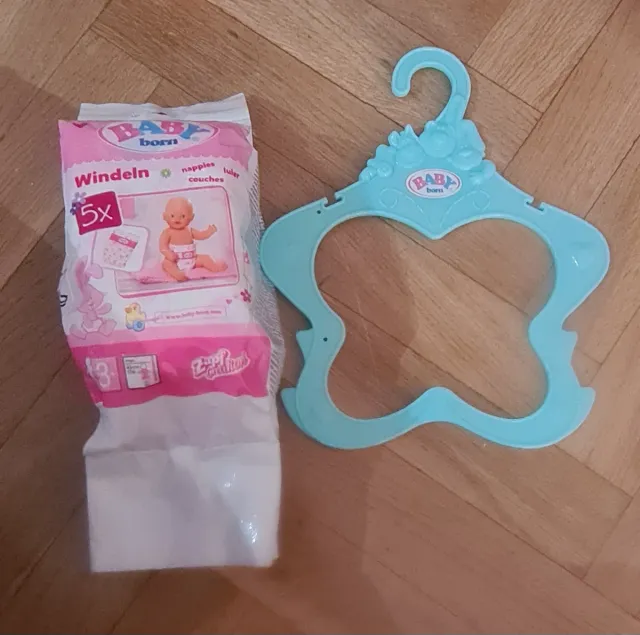 Baby born con dos trajes y percha