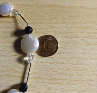 Collar con genuinas madreperlas con bello diseño.