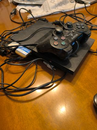Ps2 slim + 2 memory cards+ mando y juego