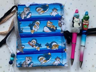 Libreta solidaria gato Mofusand y 2 bolis