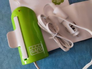 Calienta biberón/potito de coche marca Saro