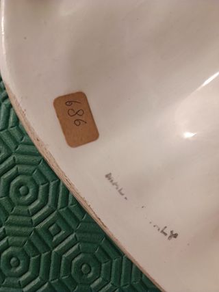 Coppia maschere italiane in ceramica smaltata