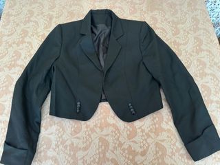 Polainas, chaqueta y fajin huaso