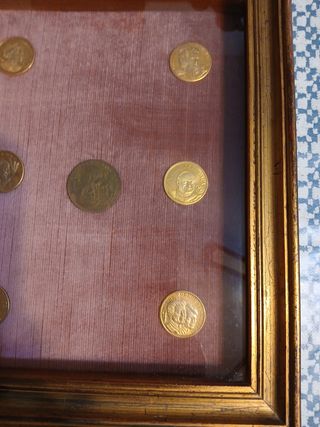 Monete incorniciate,  numismatica