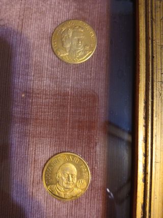 Monete incorniciate,  numismatica