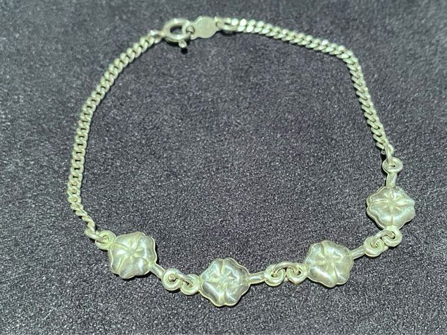Pulsera cuatro flores plata de ley 