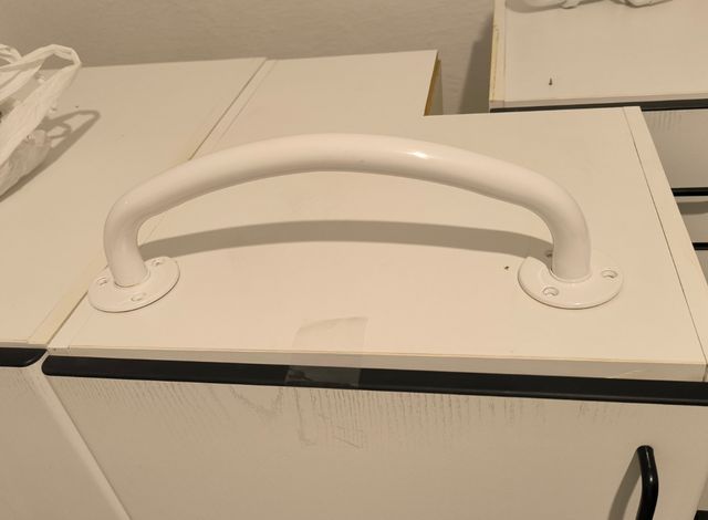 Barra metálica ducha.