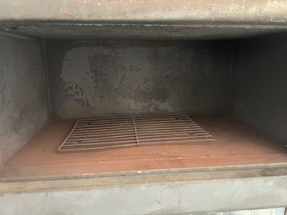 Dos estufas  de leña en una con horno