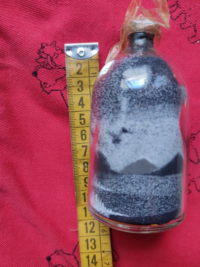 Botella con cuadro de arena