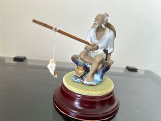 Figura exquisita pescador chino