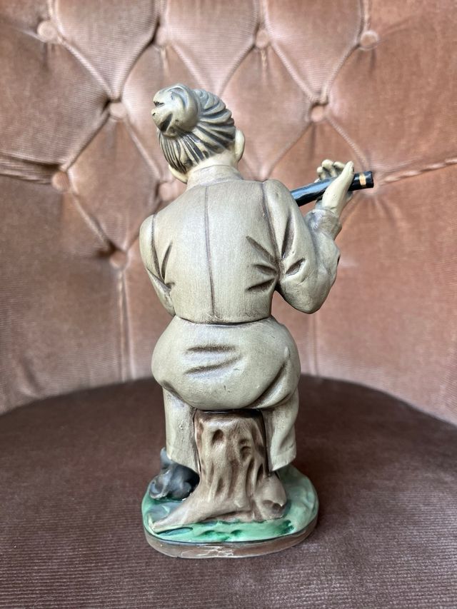 Figura porcelana flautista