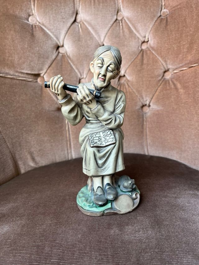 Figura porcelana flautista