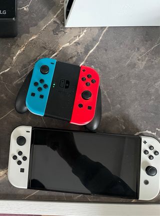 Nintendo Switch Oled con accesorios y juegos!