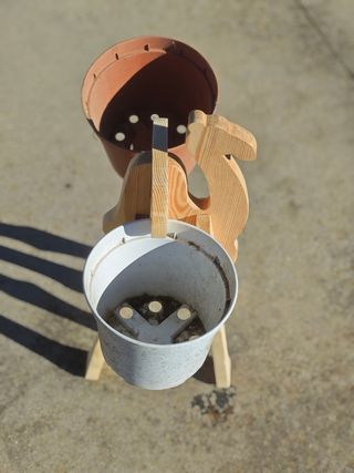 Camello soporte de macetas