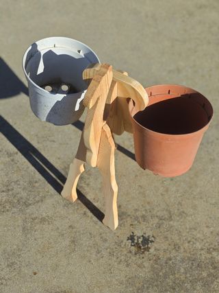 Camello soporte de macetas